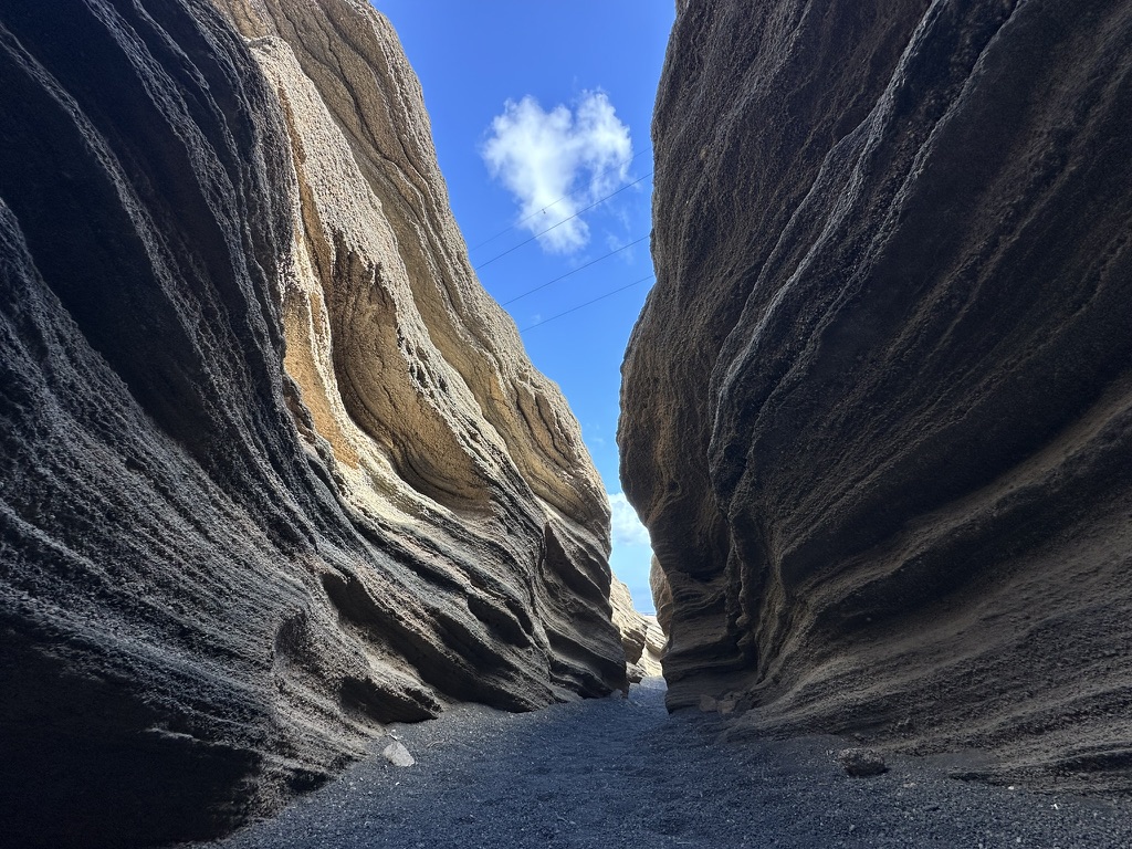 Layered rock walls of a barranco ravine