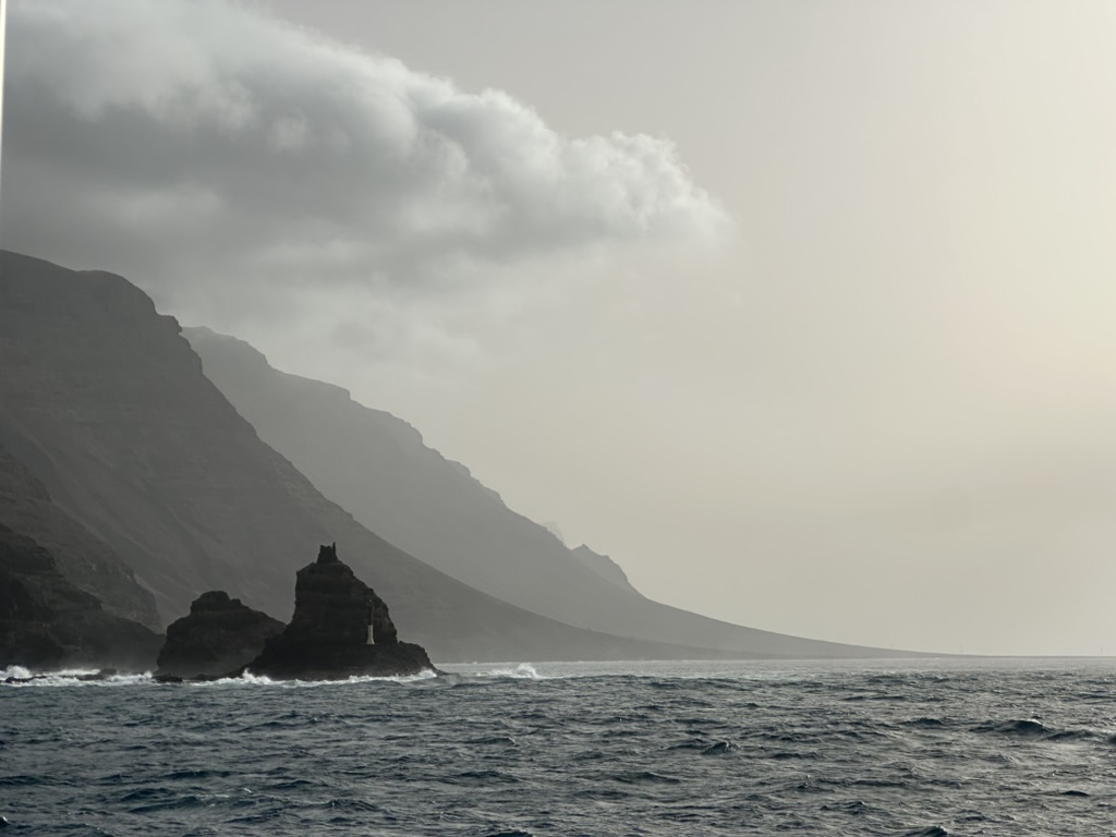 Misty coastal cliffs meeting the Atlantic