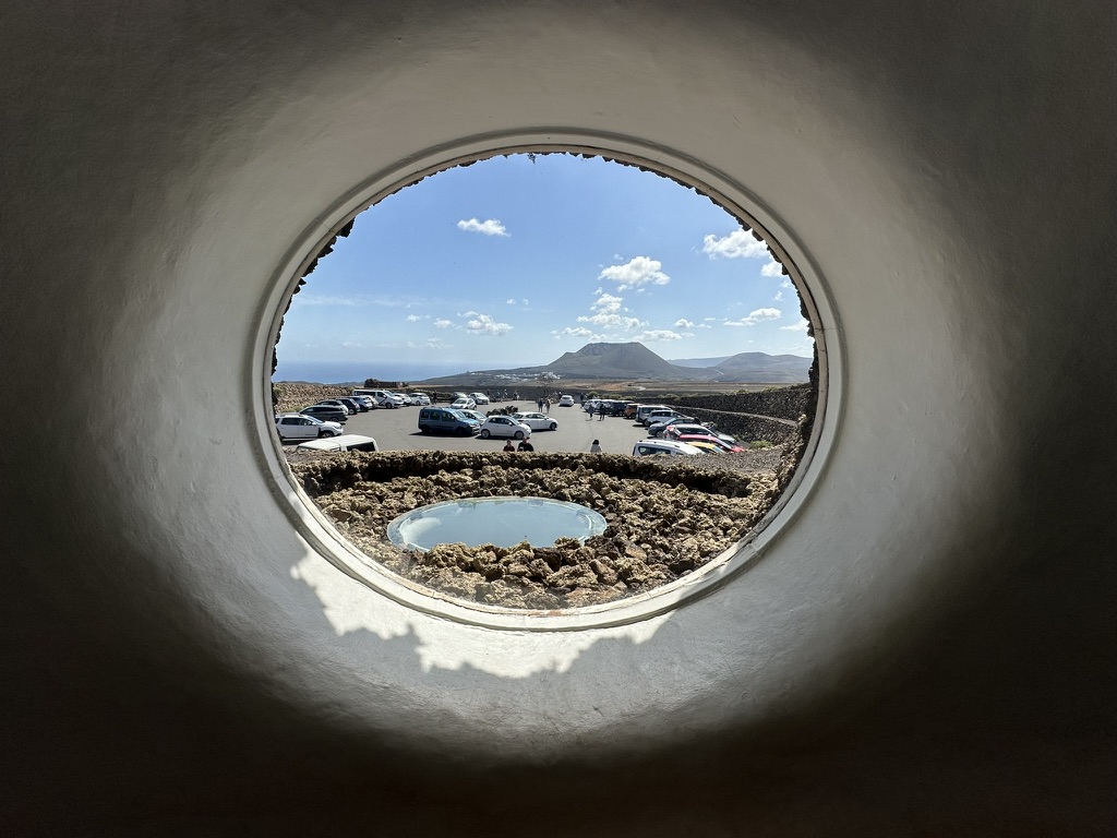 Volcano framed through a circular mirador window