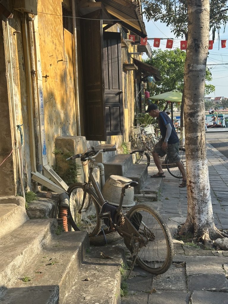Old bicycle against a weathered wall in Hoi An