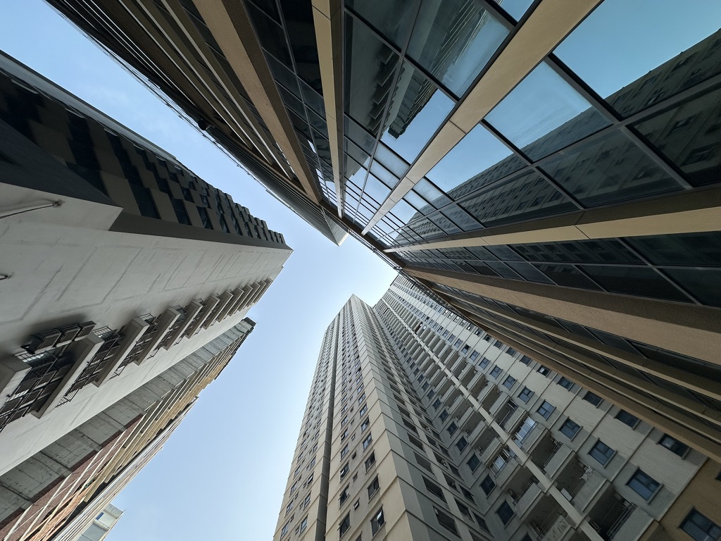 Looking up between city high-rises
